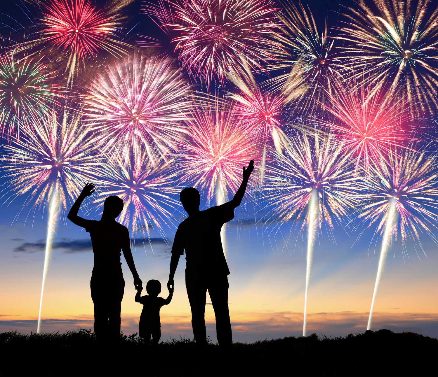 Happy family watching colorful fireworks